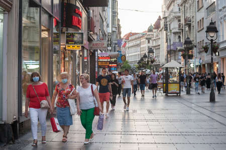 BELGRADE, SERBIA - AUGUST 13, 2020: Three old Women, white caucasian females, walking wearing face mask breathing protective equipment.のeditorial素材
