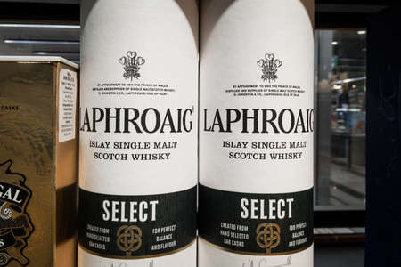 BELGRADE, SERBIA - SEPTEMBER 19, 2020: Laphroaig Whiskey logo on some bottles for sale. Laphroaig is...