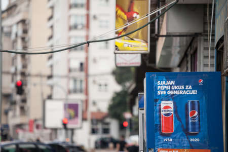 BELGRADE, SERBIA - JULY 24, 2020: Pepsi cola logo on a sign comparing the old and the new pepsi design on one of their retailers. Pepsi Cola, part of pepsico, is an american soda brand of cola.のeditorial素材