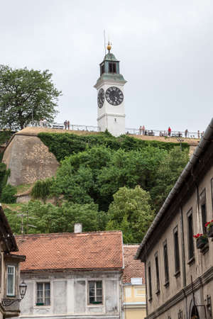 NOVI SAD, SERBIA - JULY 4, 2018: Clocktower of the Petrovaradin fortress in Novi Sad, Serbia. This fortress is one of the main landmark of Voivodina, and a symbol of the Exit music festival.のeditorial素材