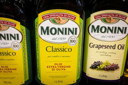 BELGRADE, SERBIA - OCTOBER 29, 2020: Monini logo on bottle of olive and grapeseed oil for sale. Monini is an idustrial italian company specialized in olive products, especially oil.のeditorial素材