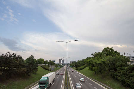 BELGRADE, SERBIA - MAY 19, 2019: Cars passing by on the Motorway going through Belgrade, Novi Beograd, during rush hour. It is one of the main expressways of the capital city of Serbiaのeditorial素材