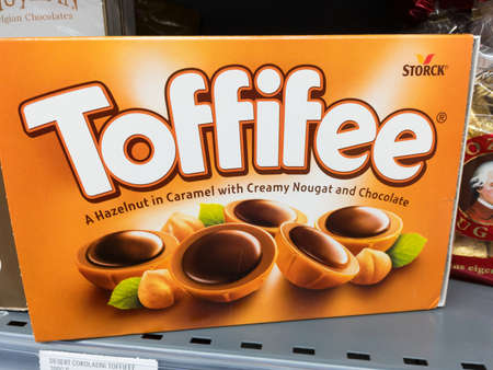 BELGRADE, SERBIA - DECEMBER 13, 2020: Toffifee logo on packs of cookies for sale. Toffifee is a brand of caramel candies biscuits produced by the German Storck.のeditorial素材