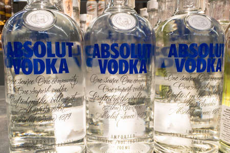 BELGRADE, SERBIA - DECEMBER 13, 2020: Absolut Vodka logo on some bottles for sale. Absolut a brand of Swedish Vodka produced by the Pernod Ricard corporation.のeditorial素材
