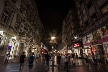 BELGRADE, SERBIA - JUNE 29, 2019: Kneza Mihailova street at night, crowded, with blurred people rushing. Also known as Knez Mihaila, this is the main pedestrian street of the city.のeditorial素材