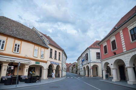 VUKOVAR, CROATIA - MAY 12, 2018: Franjo Tudjman street, the main street of the Slavonia city of Vukovar, in northern Croatia, with its iconic old Vartex buildings on a sunny day.のeditorial素材