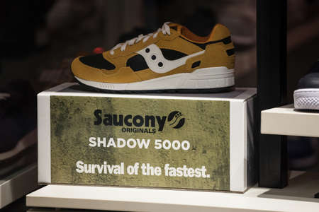 BELGRADE, SERBIA - DECEMBER 8, 2020: Saucony logo in front of one of their Shadow 5000 sports...
