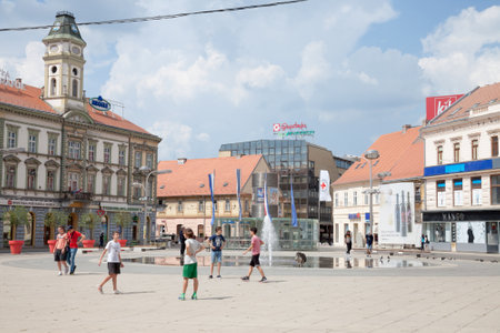 OSIJEK, CROATIA - MAY 12, 2018: Children playing football on Trg Ante Starcevica square, the main pedestrian square of the city center. Osijek is the main city of Northern Croatian region of Slavonia.のeditorial素材