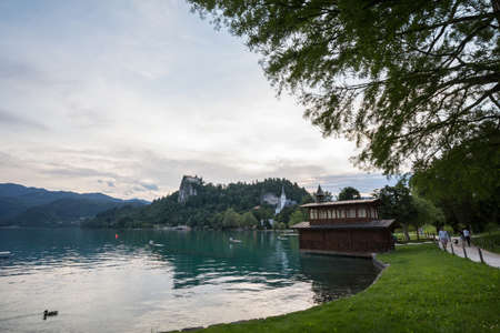 BLED, SLOVENIA - JUNE 12, 2021: Panorama of the Bled lake, Blejsko Jezero, with its castle, Blejski Hrad, during a summer sunset evening. Bled Castle is a major monument of Slovenia.のeditorial素材