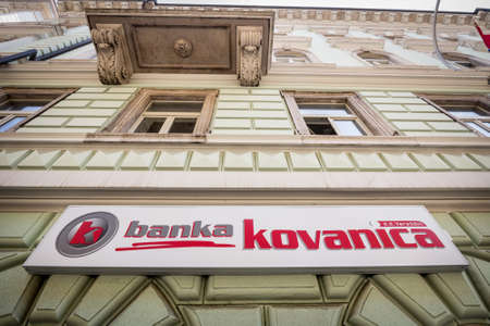 RIJEKA, CROATIA - JUNE 18, 2021: Banka Kovanica logo on their Rijeka office. Banka Kovanica is a Croatian retail and commercial bank owned by cassa di risparmio della repubblica di san marino.のeditorial素材