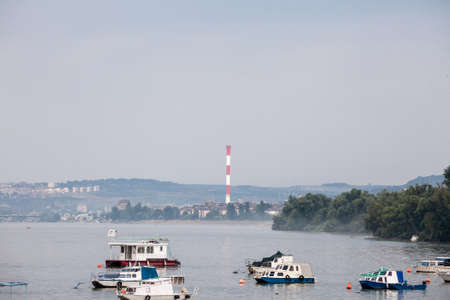 Zemun Quay (Zemunski Kej) in Belgrade, Serbia, on the Danube river, seen in autumn, during the afternoon. Boats can be seen in front, and Belgrade center in background.のeditorial素材
