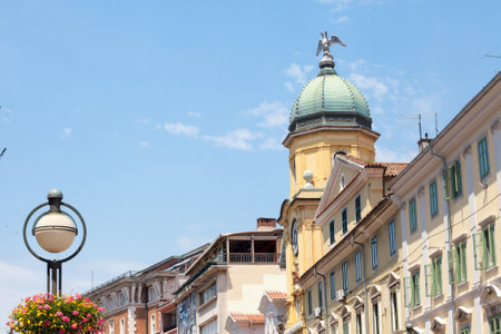 Facades of the Korzo street in Rijeka, croatia, with the city tower, or gradski toranj, a baroque clocktower from the 19th century, and a major landmark of Rijeka and Istria.の写真素材