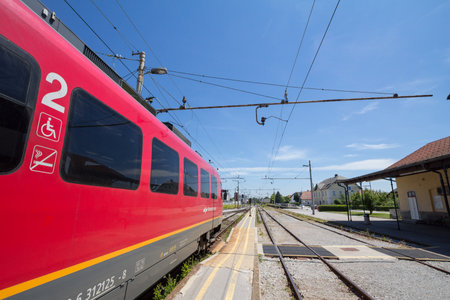 SKOFJA LOKA, SLOVENIA - JUNE 15, 2021: Slovenian Railways (Slovenske Zeleznice) EMU Electric multiple unit, a Siemens desiro Series 312 on Skofja Loka train station platform.のeditorial素材