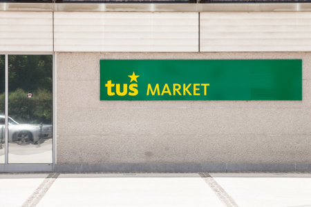 LJUBLJANA, SLOVENIA - JUNE 16, 2021: Entrance to a supermarket with the logo of Tus market. Part of Engrotus, Tus Market is a retail brand of supermarkets from slovenia specialized in mass market retailing.のeditorial素材