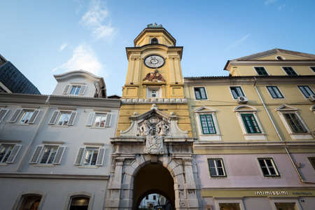 RIJEKA, CROATIA - JUNE 17, 2021: Facades of the Korzo street in Rijeka, croatia, with the city tower, or gradski toranj, a baroque clocktower from the 19th century, and a major landmark of Rijeka and Istria.のeditorial素材