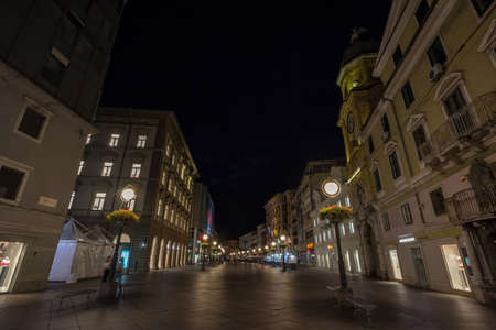 RIJEKA, CROATIA - JUNE 18, 2021: Selective blur on the empty  Korzo street at night in summer. Korzo is the main pedestrian street of Rijeka, on the adriatic sea.のeditorial素材