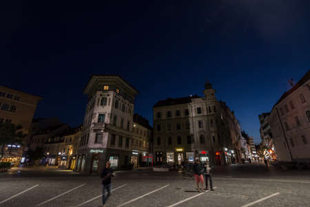 LJUBLJANA, SLOVENIA - JUNE 14,2021: Selective blur on Presernov trg, or Preseren square, the main square of Ljubljana, with pedestrians passing by with a speed blur.のeditorial素材