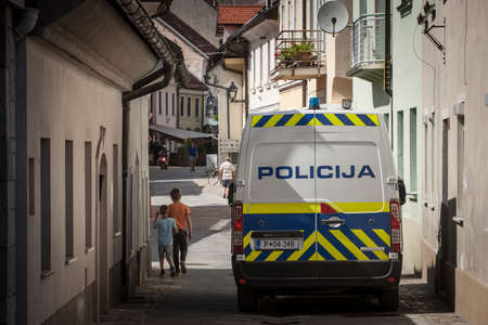 LJUBLJANA, SLOVENIA - JUNE 15, 2021: Slovenian police van standing in a pedestrian way while patrolling. Policija Slovenia, or police of slovenia, is the main law enforcement force in Slovenia.のeditorial素材
