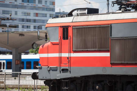 Red electric locomotive of Slovenian Railways shunting on Ljubljana train station platform getting ready for departure. it is the main hub of slovenian railroad.の写真素材