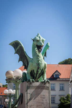 Close up on Dragon statue on zmajski most, or zmajev most (Dragon bridge) in Ljubljana, capital city of Slovenia from the late 19th century. The dragon is the symbol of the city, protecting it.のeditorial素材