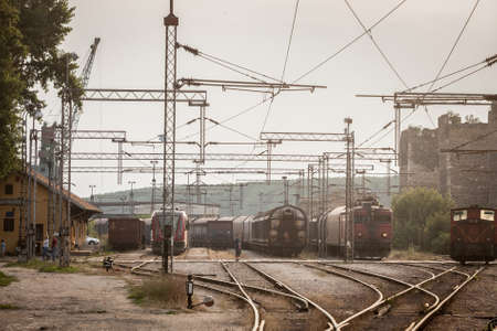 SMEDEREVO, SERBIA - JULY 25, 2021: Selective blur on freight trains in Smederevo train station, belonging to Srbija Kargo Serbian railways on standby before departure. Srbija Cargo is main freight railway carrier.のeditorial素材