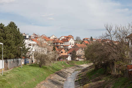 Panorama of Resnik district, with the river topciderska reka passing by a typical suburban settlement with individual residential houses. Resnik is a district of Belgrade in Rakovica municipality.の写真素材