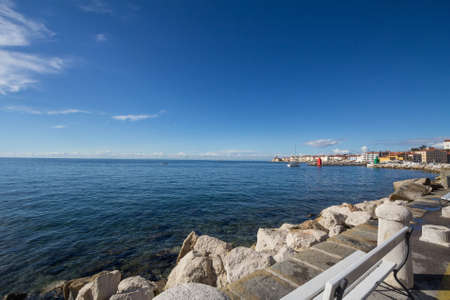 Panorama of the Adriatic sea, with blue water and sky, on a wharf and quay in Piran, slovenia, during a sunny summer afternoon. Piran, or Pirano, is a slovenian city on the adriatic sea in istria.の写真素材