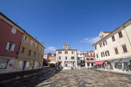 KOPER, SLOVENIA - SEPTEMBER 17, 2021: Fontana Da ponte Fountain, or da pontejev vodnja, on Presernov trg, in the old town of Koper, a medieval city of italian adriatic architecture style.のeditorial素材