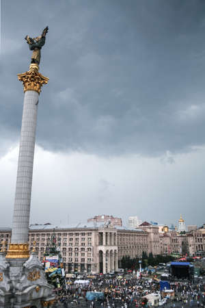 KYIV, UKRAINE - AUGUST 9, 2014: Euromaidan revolutions barricade in front of the column of the Monument to independence during the revolution & protests on Maidan Square.のeditorial素材