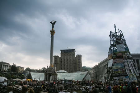 KYIV, UKRAINE - AUGUST 9, 2014: Euromaidan revolutions barricade in front of Hotel ukrayina and Monument to independence during the revolution & protests on Maidan Square.のeditorial素材