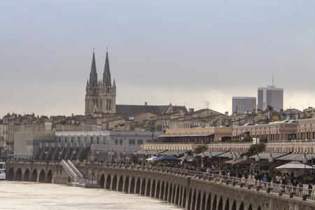 BORDEAUX, FRANCE - FEBRUARY 20, 2022: Crowd walking by the garonne quay (quais de la garonne) on Les...
