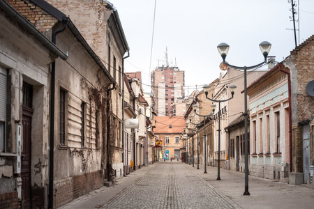 PANCEVO, SERBIA - FEBRUARY 7, 2021: Typical residential street, empty, zith nobody, during covid coronavirus pandemic, at dusk in the center of Pancevo, a Voivodina city.のeditorial素材