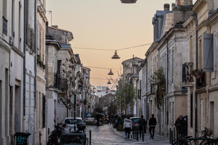 BORDEAUX, FRANCE - FEBRUARY 19, 2022: Selective blur on typical bordeaux buildings called echoppes bordelaises in a typical french city street in the historical center of Bordeaux, France, in the French South West.のeditorial素材