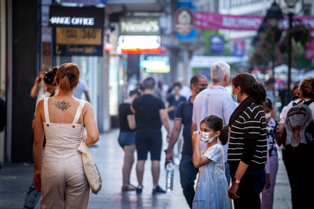 BELGRADE, SERBIA - AUGUST 11, 2021: Family, a woman, mother, and their child, girl, a daughter...