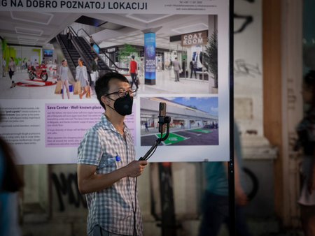 BELGRADE, SERBIA - JULY 14, 2022: Selective blur on a Young Asian man, Chinese, wearing a...