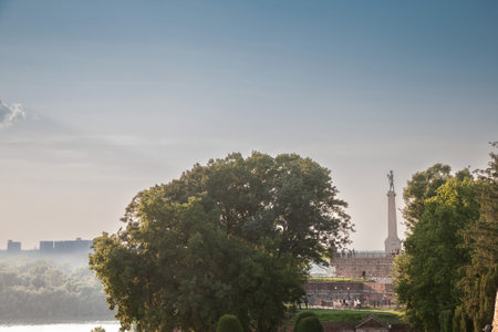 BELGRADE, SERBIA - JULY 11, 2018: Victor statue on Kalemegdan fortress, during a sunny afternoon. Located in Kalemegdan fortress, it's a landmark of the city of Belgrade, Serbia.のeditorial素材