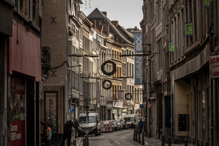 LIEGE, BELGIUM - NOVEMBER 9, 2022: Rue du pont, a decaying street of the city center of Liege, with facade of old buildings ready to be renovated in a real estate operation.のeditorial素材
