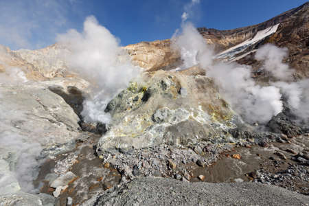 Volcanic landscape of Kamchatka: brimstone and fumarole field in crater of active Mutnovsky Volcano. Russia Far East Kamchatka Peninsulaの写真素材