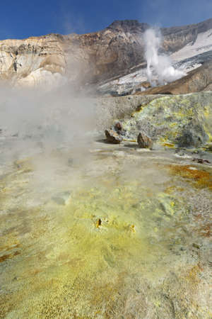 Volcanic landscape of Kamchatka: brimstone and fumarole field in crater of active Mutnovsky Volcano. Russia Far East Kamchatka Peninsula.の写真素材