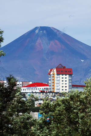 PETROPAVLOVSK-KAMCHATSKY, KAMCHATKA, RUSSIA - AUGUST 18, 2012: Summer cityscape: view of Petropavlovsk-Kamchatsky City and beautiful active Avacha Volcano on a sunny day. Far East, Russia.のeditorial素材