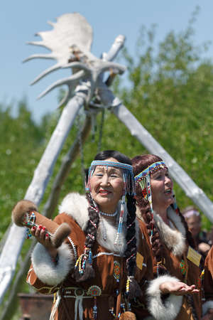 ELIZOVO, KAMCHATKA, RUSSIA - JUNE 15, 2013: Woman in clothes aborigine of Kamchatka. Celebration of Day of the first fish - ritual celebration indigenous people of Kamchatka.のeditorial素材