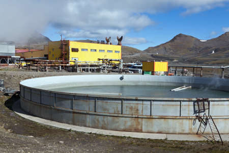 MUTNOVSKY VOLCANO, KAMCHATKA, RUSSIA - SEP 21, 2011: View of pool to collect the waste thermal water on Mutnovskaya Geothermal Power Station. Eurasia, Russian Far East, Kamchatka Peninsula.のeditorial素材