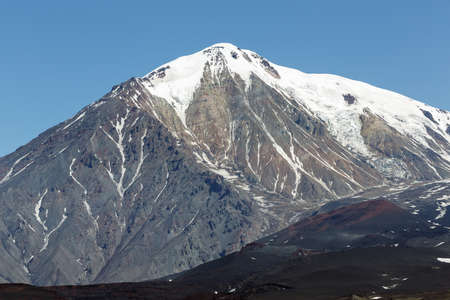 Beautiful volcanic landscape of Kamchatka: summer view of cone of Ostry Tolbachik Volcano in a cloudless, clear weather. Eurasia, Russia, Far East, Kamchatka Peninsula, Klyuchevskaya Group of Volcanoes.の写真素材