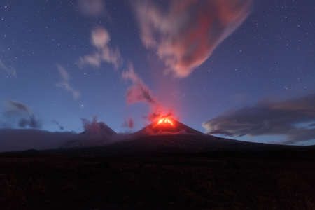Beautiful volcanic landscape of Kamchatka: night view of eruption active Klyuchevskaya Sopka. Eurasia, Russia, Far East, Kamchatka Peninsula, Klyuchevskaya Group of Volcanoes.の写真素材