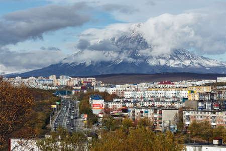 PETROPAVLOVSK-KAMCHATSKY, KAMCHATKA PENINSULA, RUSSIA - OCTOBER 11, 2016: Kamchatka autumn view of city landscape of Petropavlovsk-Kamchatsky City on background beautiful active Koryaksky Volcano.のeditorial素材