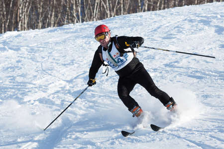 KRASNAYA SOPKA, PETROPAVLOVSK-KAMCHATSKY, KAMCHATKA, RUSSIA - FEB 4, 2012: Ski mountaineer rides skiing on mountain. Ski-mountaineering competitions - Cup Petropavlovsk-Kamchatsky City.のeditorial素材