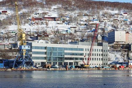 PETROPAVLOVSK-KAMCHATSKY CITY, KAMCHATKA PENINSULA, RUSSIA - DEC 31, 2016: Winter view of new modern building of Marine Station in commercial sea port Petropavlovsk-Kamchatsky on Avacha Bay.のeditorial素材