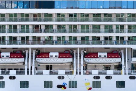 PACIFIC OCEAN, KAMCHATKA PENINSULA, RUSSIAN FAR EAST - 10 MAY, 2019: Multiple deck of luxury Expedition Passenger Cruise Liner Norwegian Jewel (Norwegian Cruise Line) with lifeboats aboard ship.のeditorial素材