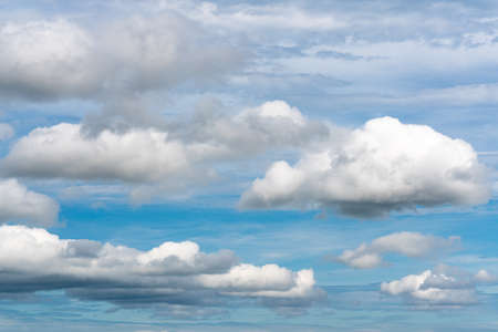 Beautiful summer clouds floating across sunny blue sky to change weather. Stunning cloud scape, view...