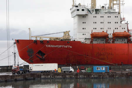 Sevmorput - nuclear-powered ice breaking lighter aboard ship carrier, Russian container ship anchored container terminal commercial seaport. Pacific Ocean, Kamchatka Peninsula, Russia - Aug 26, 2019のeditorial素材